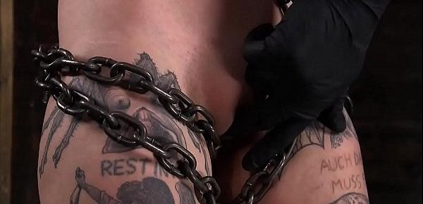  Tattooed slave is clamped and vibrated